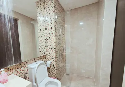 a bathroom with a toilet and a shower at The Element Condo 3BR with KL Skyscraper View in Kuala Lumpur