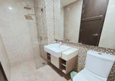 a bathroom with a toilet and a sink and a shower at The Element Condo 3BR with KL Skyscraper View in Kuala Lumpur