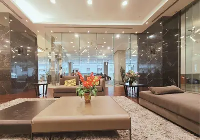 a living room with a couch and a table at The Element Condo 3BR with KL Skyscraper View in Kuala Lumpur