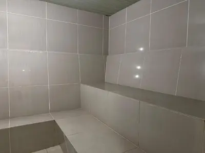a room with white tiled walls and shelves at Times Square Service Suites KL, Fortune in Kuala Lumpur