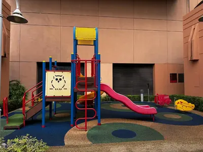 a playground with a slide in front of a building at Times Square Service Suites KL, Fortune in Kuala Lumpur