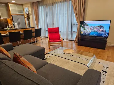 a living room with a couch and a tv at Urban Oasis at St Mary klcc 1Bed2bath in Kuala Lumpur