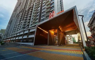 a large building with a sign on the front of it at The E48-10 Stay in Kuala Lumpur