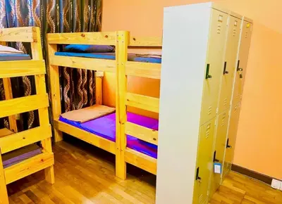 a room with two bunk beds and a closet at Regalia Skypool KLCC Dorms By Tasrifa in Kuala Lumpur