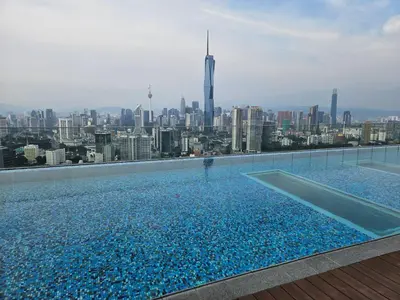 a swimming pool with a view of the city at SerenityStayatRiveria KL Sentral in Kuala Lumpur