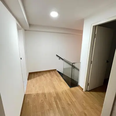 an empty room with a glass stair case at EKO CHERAS mall kids play room Big sofa MRT 8 pex in Kuala Lumpur