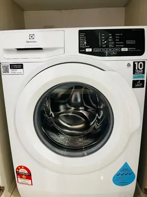 a white washing machine with its door open at Chambers Kl by MRJ in Kuala Lumpur