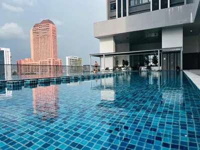 a large swimming pool on top of a building at Chambers Kl by MRJ in Kuala Lumpur