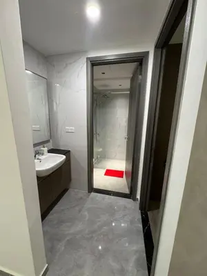 a bathroom with a shower and a sink and a mirror at Agile Bukit Bintang by SOD in Kuala Lumpur