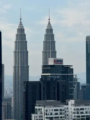 a view of two tall buildings in a city at Agile Bukit Bintang by SOD in Kuala Lumpur