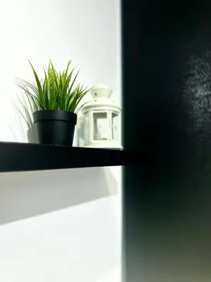a shelf with a plant and a pot on it at Studio Room at Neu Suites, Jalan Ampang KL in Kuala Lumpur