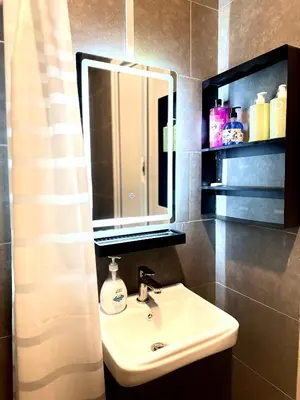 a bathroom with a sink and a mirror at Studio Room at Neu Suites, Jalan Ampang KL in Kuala Lumpur