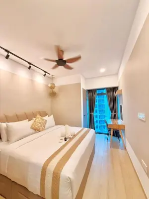 a bedroom with a bed and a ceiling fan at PANORAMIC SUITES at Eaton residence in Kuala Lumpur