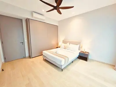 a bedroom with a bed and a ceiling fan at PANORAMIC SUITES at Eaton residence in Kuala Lumpur