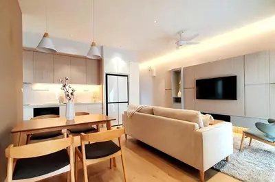 a living room with a couch and a table at TR Residence 2BR KL View Near MRT LRT Monorail in Kuala Lumpur