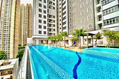 a large swimming pool in a city with tall buildings at TR Residence 2BR KL View Near MRT LRT Monorail in Kuala Lumpur