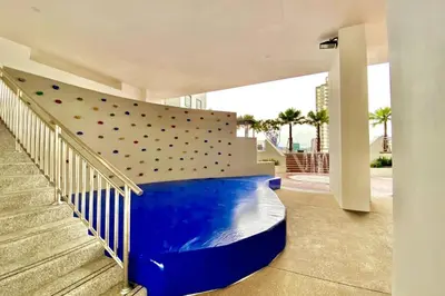 a indoor gym with a climbing wall in a building at TR Residence 2BR KL View Near MRT LRT Monorail in Kuala Lumpur