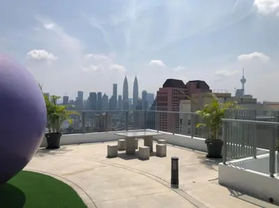 a view of a city skyline from a balcony at TR Residence 2BR KL View Near MRT LRT Monorail in Kuala Lumpur