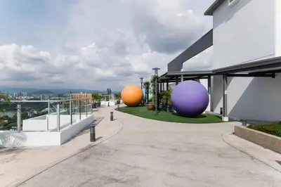 three large spheres sitting on the side of a building at TR Residence 2BR KL View Near MRT LRT Monorail in Kuala Lumpur