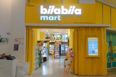a store entrance to a store with a skateboard in it at Best View Hostel Regalia KLCC in Kuala Lumpur