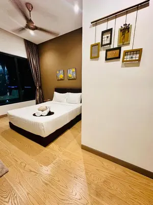a bedroom with a white bed and a large window at LUCENTIA RESIDENCE BY Glory Home in Kuala Lumpur