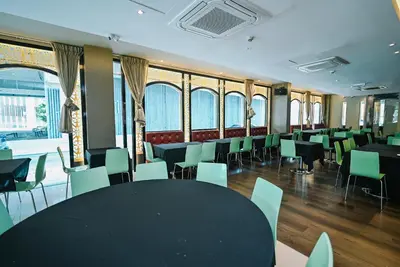 a conference room with a black table and chairs at Kingston Hotel 11 - PWTC, KL in Kuala Lumpur