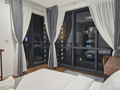 a bedroom with a bed and a large window at Cemara Premier Residence Ampang Near KLCC Kuala Lumpur in Kuala Lumpur