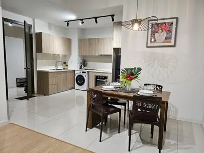 a kitchen with a table and chairs in a room at Cemara Premier Residence Ampang Near KLCC Kuala Lumpur in Kuala Lumpur