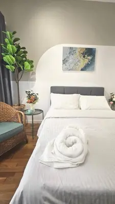 a white towel on a bed in a bedroom at Nyiur Premier Residence Ampang Near KLCC Kuala Lumpur in Kuala Lumpur