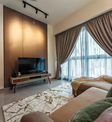 a living room with a flat screen tv and two beds at Central of KL 1-5px - 10 mins TRX and Bukit Bintang in Kuala Lumpur