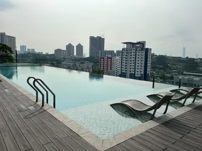 a large swimming pool on the roof of a building at Societe by Bamboo Hospitality in Kuala Lumpur