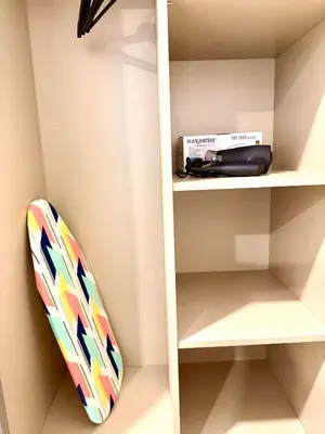 a surfboard is sitting on a shelf at Eaton Residence KLCC in Kuala Lumpur