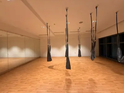 an empty room with black umbrellas hanging from the ceiling at Eaton Residence KLCC in Kuala Lumpur