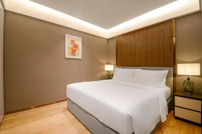 a bedroom with a large white bed in it at Imperial KLCC by Premium Hospitality in Kuala Lumpur