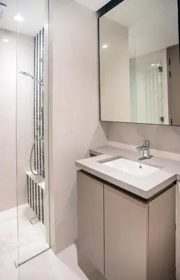 a bathroom with a sink and a mirror at Eaton Kuala Lumpur with KLCC Skyline View Pool in Kuala Lumpur