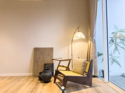 a living room with a chair and a table at Japandi Studio w Bathtub - Linked to Quill City Mall in Kuala Lumpur