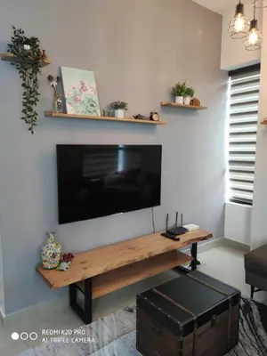 a living room with a flat screen tv on a wall at Best & Affordable KL Arte Plus 2 bedroom Homestay in Kuala Lumpur