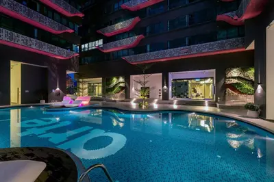 a swimming pool in the middle of a building at Best & Affordable KL Arte Plus 2 bedroom Homestay in Kuala Lumpur