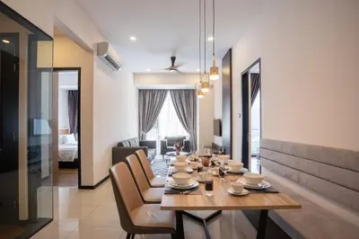 a dining room with a table and chairs at Luxe Suite in Kuala Lumpur