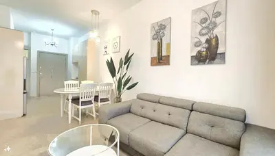 a living room with a couch and a table at Bukit Bintang Fairlane Residence Pavilion KLCC #A25 in Kuala Lumpur