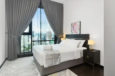 a bedroom with a large bed and a large window at KL Panorama in Kuala Lumpur