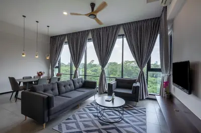 a living room with a couch and chairs and a large window at KL Panorama in Kuala Lumpur