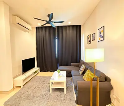 a living room with a couch and a ceiling fan at Lucentia Global Luxe Suites Kuala Lumpur in Kuala Lumpur