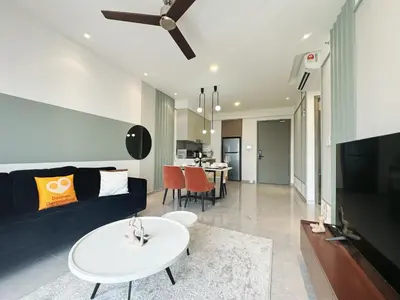 a living room with a couch and a table at Agile Bukit Bintang TRX Pavilion KL by WSD in Kuala Lumpur