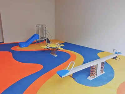 a play room with a playground with a slide at Eaton Residence KLCC Elite Suites in Kuala Lumpur