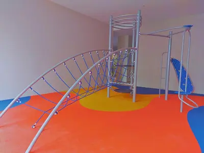 an indoor playground with a spiral staircase in a room at Eaton Residence KLCC Elite Suites in Kuala Lumpur