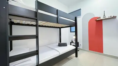 a bedroom with two bunk beds in a room at Vista Sentul Residences, 3-Bedroom Fully Air-Con Suite, SENTUL in Kuala Lumpur