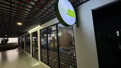 a store with a sign on the side of a building at Vista Sentul Residences, 3-Bedroom Fully Air-Con Suite, SENTUL in Kuala Lumpur