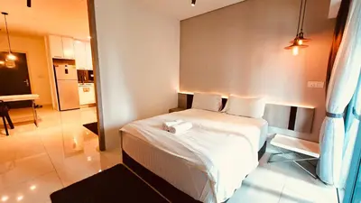 a bedroom with a large white bed in a room at Mercu Summer Suites KL City Centre in Kuala Lumpur