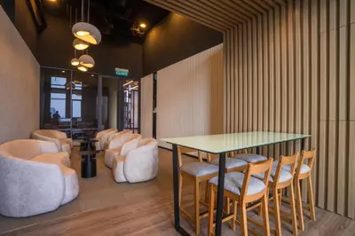 a conference room with a table and chairs at Societe by fafa in Kuala Lumpur